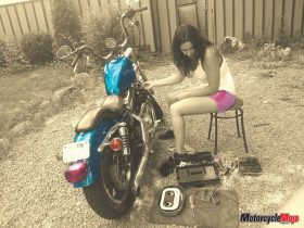 Emily Smith Working on Her Motorcycle